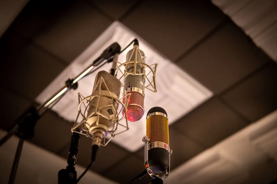 Studio microphones in warm light